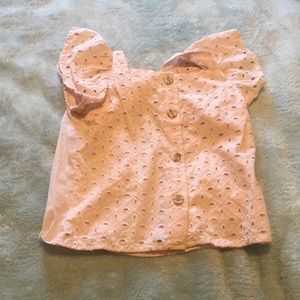 Pink summer top with buttons.